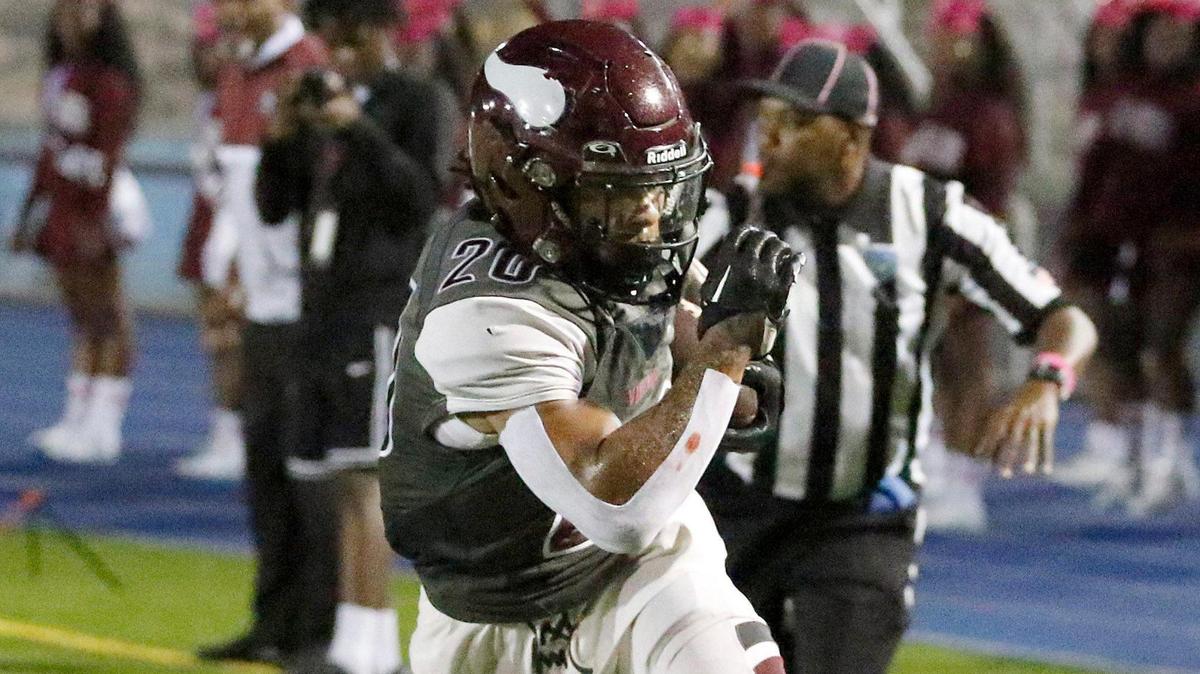 Norland Vikings running back Juan Rodriguez (20), seen here escaping a tackle by Columbus Explorers defender during a football game on October 20, 2023, ran for 195 yards and a touchdown on Friday at Traz Powell Stadium.