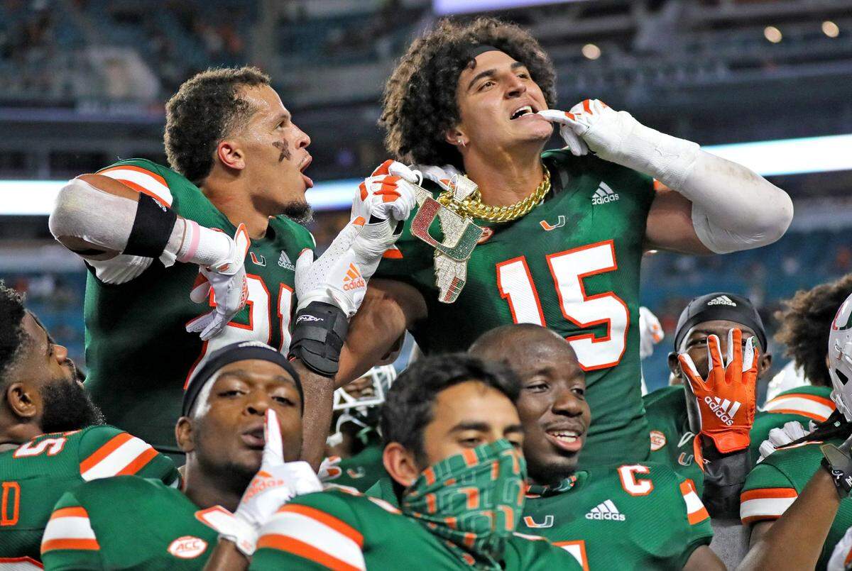 UM’s defensive lineman Jaelan Phillips (15) celebrates a second quarter turn over with the Turn Over chain as the University of Miami host Florida State University Seminoles at Hard Rock Stadium in Miami Gardens on Saturday, September 26, 2020.