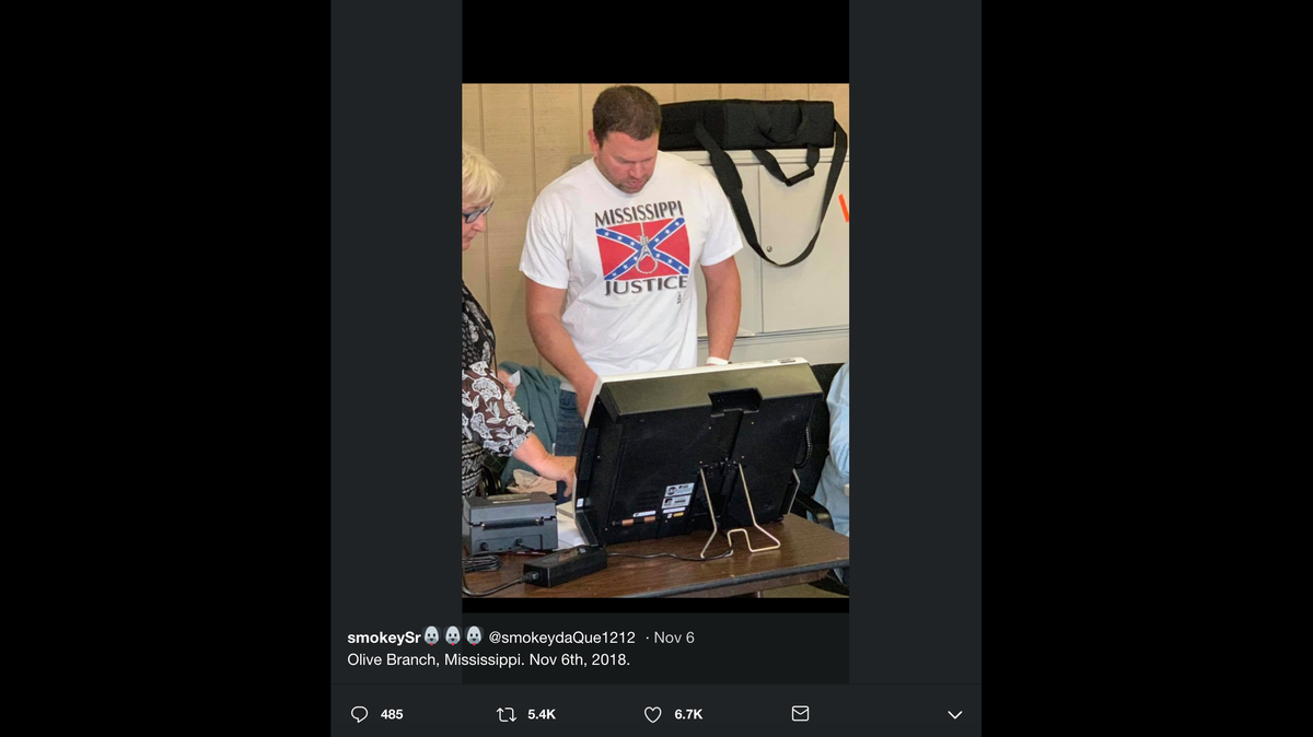 Clayton Hickey has been identified by local outlets as the Olive Branch, Mississippi, man wearing a racist T-shirt with a Confederate flag and a noose. He is a former cop and worker at Regional One Health.