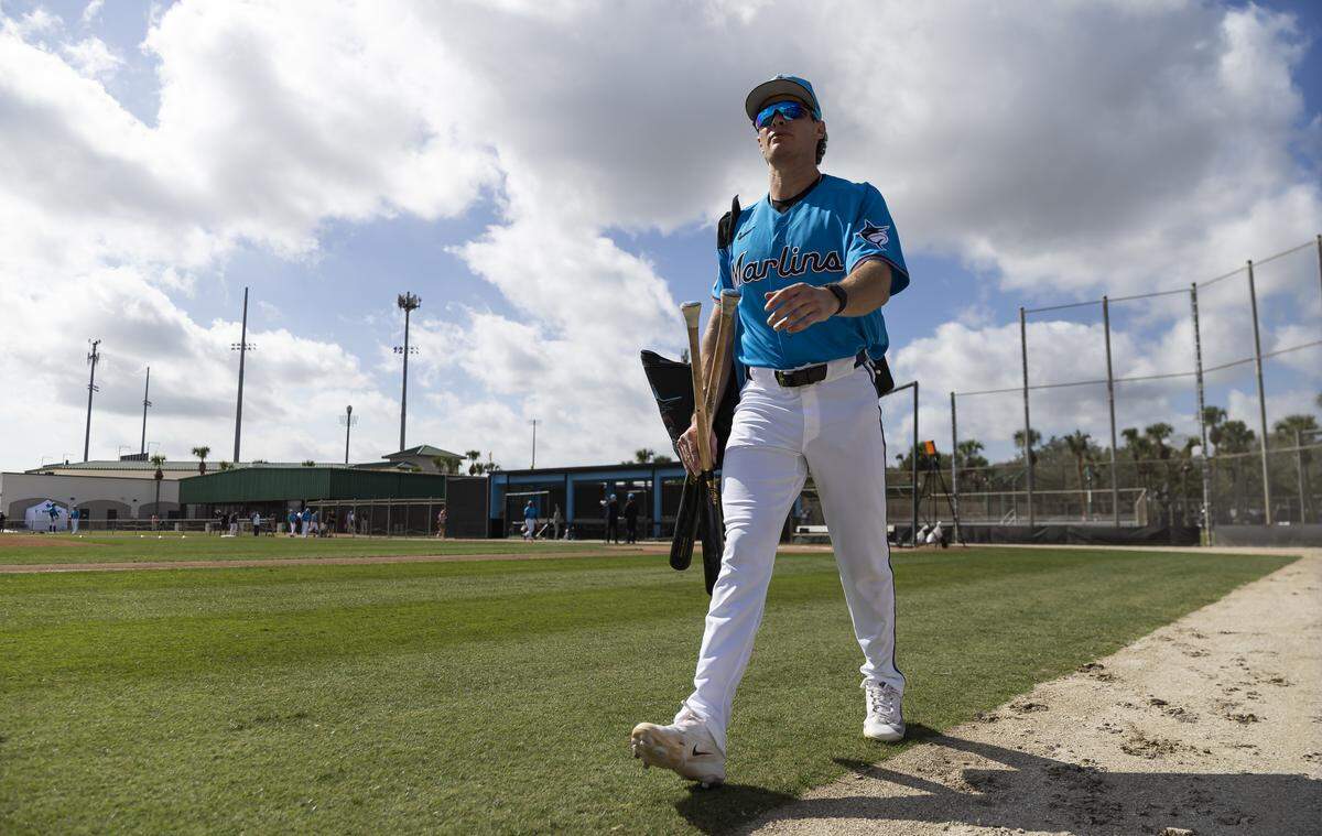 Miami Marlins left fielder Griffin Conine (18) arrives to his team’s first full-squad spring training workout at Roger Dean Stadium on Monday, Feb. 16, 2026, in Jupiter, Fla.