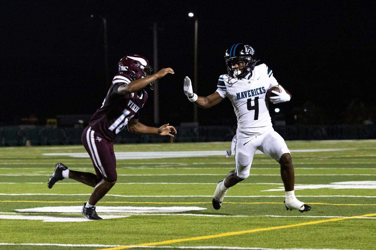 Archbishop McCarthy Mavericks running back Malik Denson (4) runs the ball while chased by Norland Vikings defensive back Xavier Baker (18) during a high school football game at Traz Powell Stadium on Thursday, September 25, 2025, in Miami, Fla.