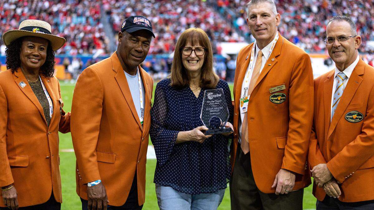 Then-Miami Herald sports writer Susan Miller Degnan is inducted into the Orange Bowl Hall of Fame during the Orange Bowl game at Hard Rock Stadium on Saturday, Dec. 30, 2023 in Miami Gardens, Fla. On Friday, Jan. 16, 2026, she will receive the Football Writers Association of America’s Lifetime Achievement Award.