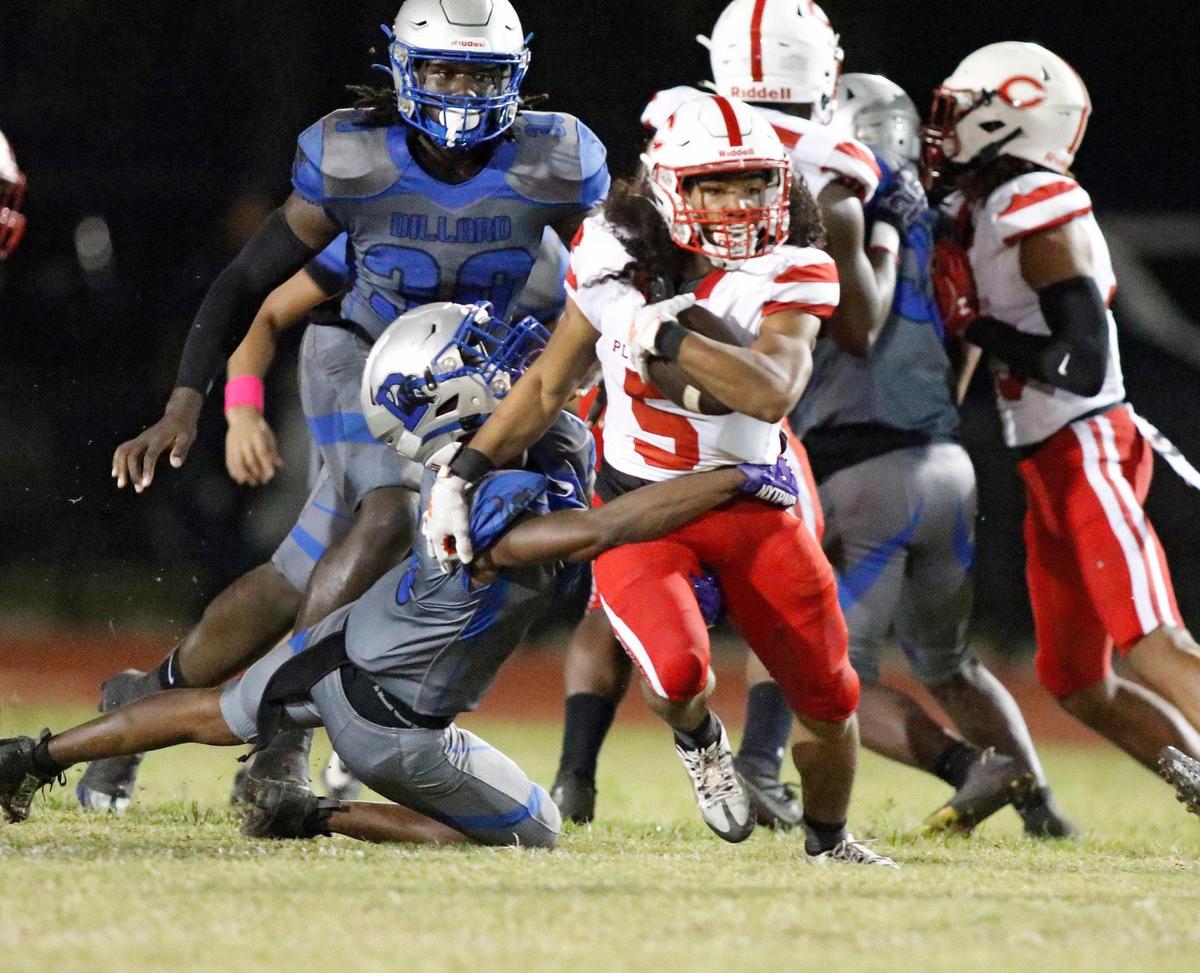 Plantation Colonels running back Jordan Reed (5) breaks free from Dillard Panthers defenders during the football game on Friday, October 13, 2023 in Fort Lauderdale.