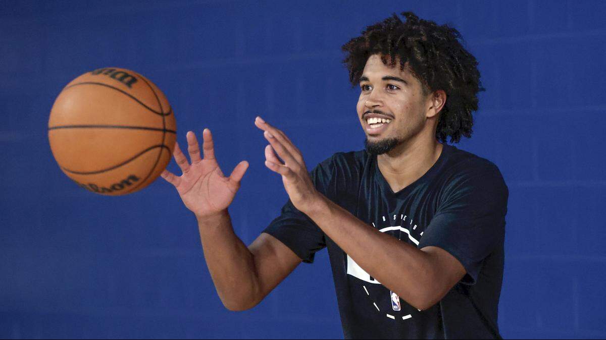 Miami Heat guard Ethan Thompson catches the ball during practice drills at Abessino Court at Eleanor R. Baldwin Arena at Florida Atlantic University in Boca Raton, Florida, on Thursday, October 2, 2025. 