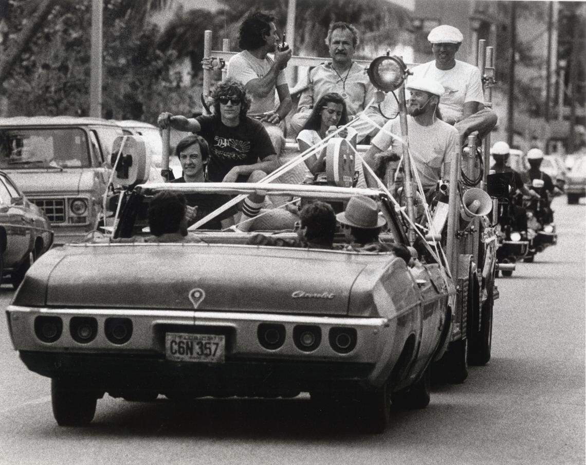 In this file photo from April 21, 1983, a film crew shoots a scene from Brian DePalma’s "Scarface" on Ocean Drive in South Beach. Several scenes from the violent drama that starred Al Pacino as Tony Montana, a fictional crime boss who had arrived on the May 1980 Mariel boat lift, were filmed in Miami Beach. But most of the movie was shot in Los Angeles when Miami officials balked at granting permits.