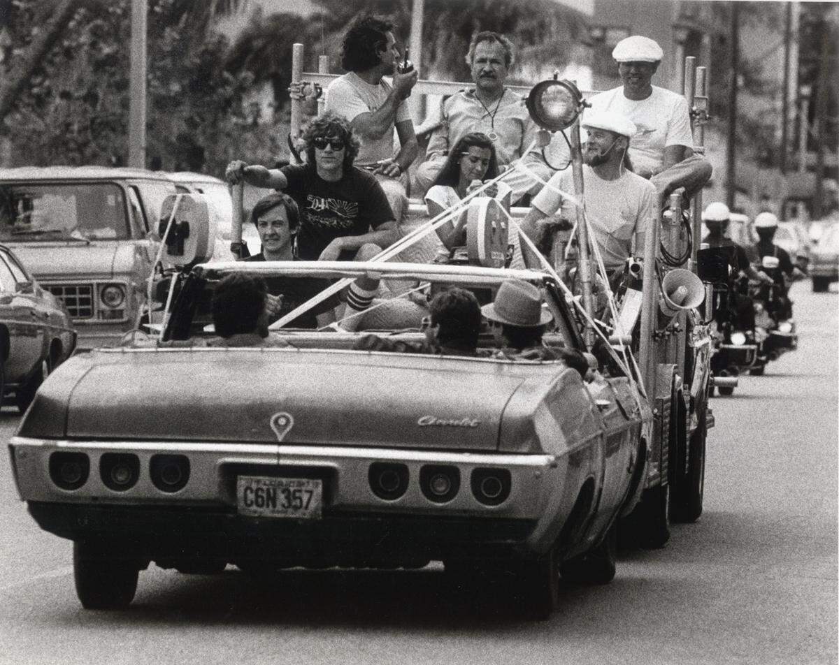 In this file photo from April 21, 1983, a film crew shoots a scene from Brian DePalma’s "Scarface" on Ocean Drive in South Beach. Several scenes from the violent drama that starred Al Pacino as Tony Montana, a fictional crime boss who had arrived on the May 1980 Mariel boat lift, were filmed in Miami Beach. But most of the movie was shot in Los Angeles when Miami officials balked at granting permits.