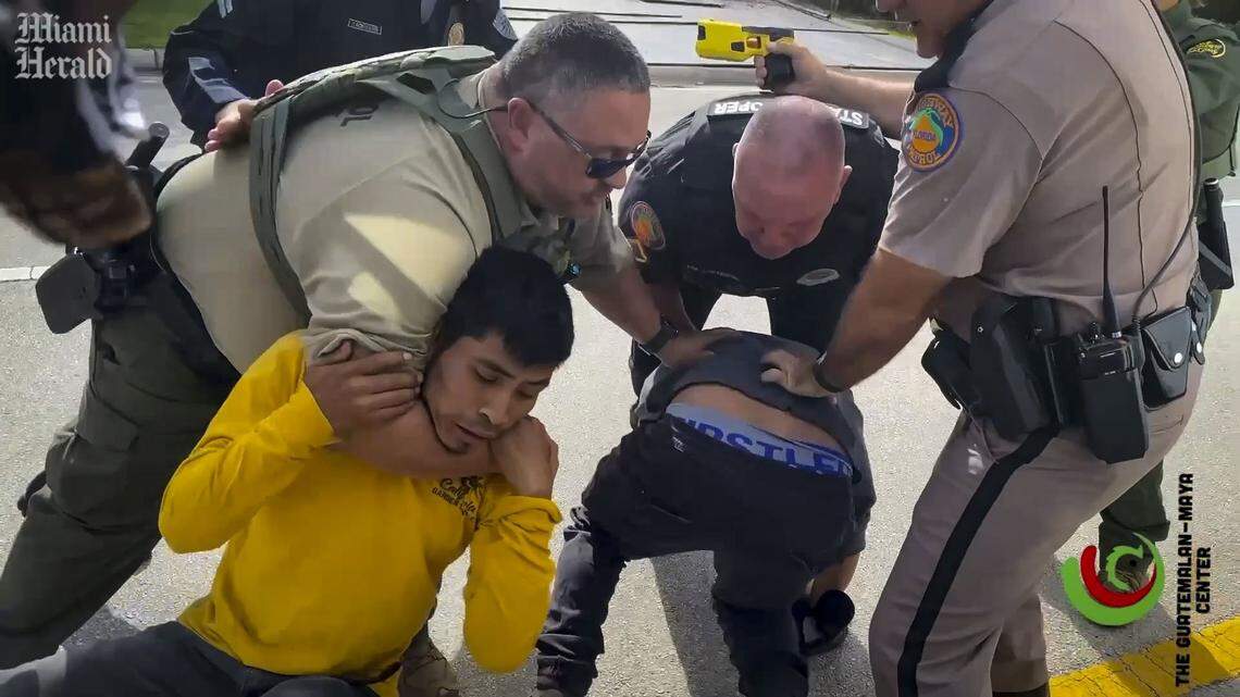 In this frame grab from video, as Kenny Laynez Ambrocio films from inside the vehicle, one of the other passengers is put in a choke hold and the other passenger is wrestled to the ground. Laynez Ambrocio, an 18-year-old U.S. citizen, recorded his arrest by Florida Highway troopers and Border Patrol agents during a traffic stop. Then, he was criminally charged.