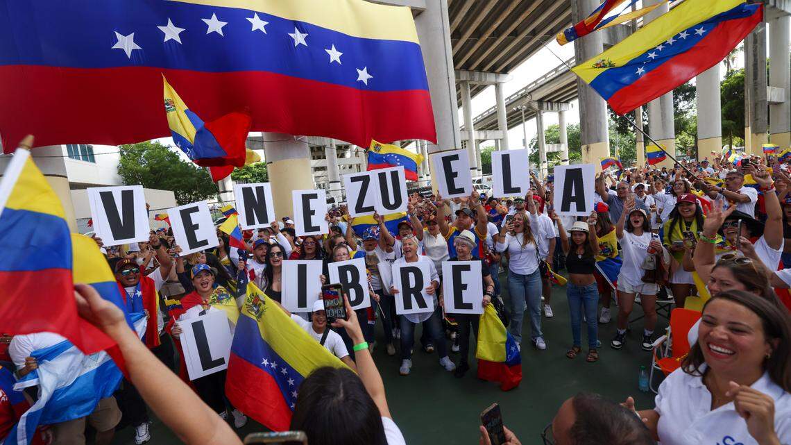 People bring signs that spell out “Venezuela Libre” during a rally at Jose Marti Gym held in support of a fair election on Venezuela’s Election Day on Sunday, July 28, 2024, in Miami.