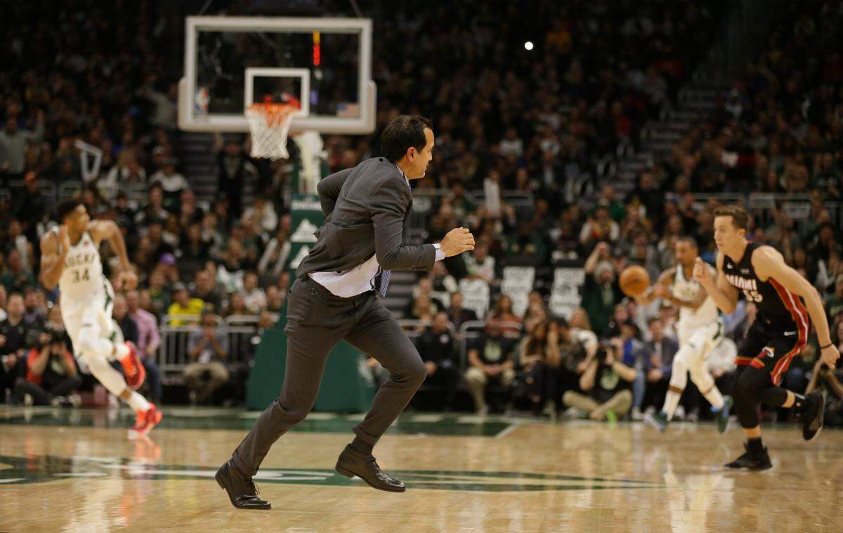 Miami Heat head coach Erik Spoelstra runs across the court during the second half of an NBA basketball game against the Milwaukee Bucks during play Saturday, Oct. 26, 2019, in Milwaukee. Spoelstra received a technical foul. (AP Photo/Jeffrey Phelps)