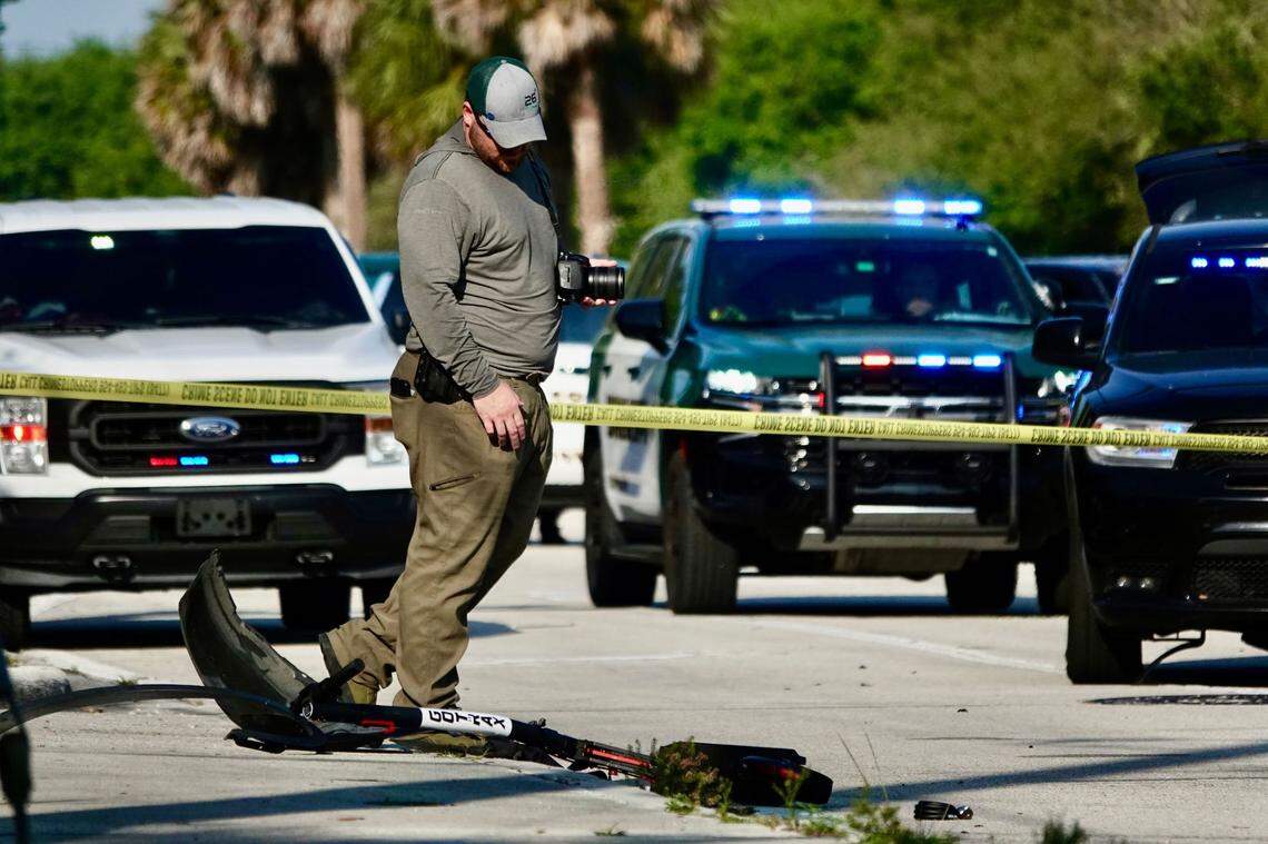 A Broward County Sheriff’s Office deputy investigates the scene where a child riding a scooter was struck by a vehicle on Monday, March 18, 2024. (Joe Cavaretta/South Florida Sun Sentinel)