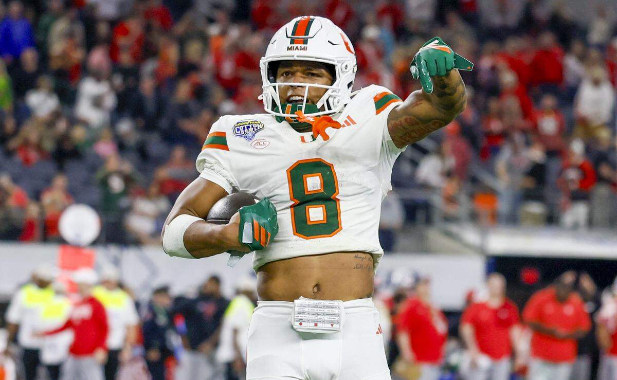 Miami Hurricanes defensive back Jakobe Thomas (8) reacts after intercepting the balll in the final minute of the game against the Ohio State Buckeyes during the College Football Playoff quarterfinal in the Cotton Bowl at AT&T Stadium in Arlington, Texas on Wednesday, December 31, 2025.