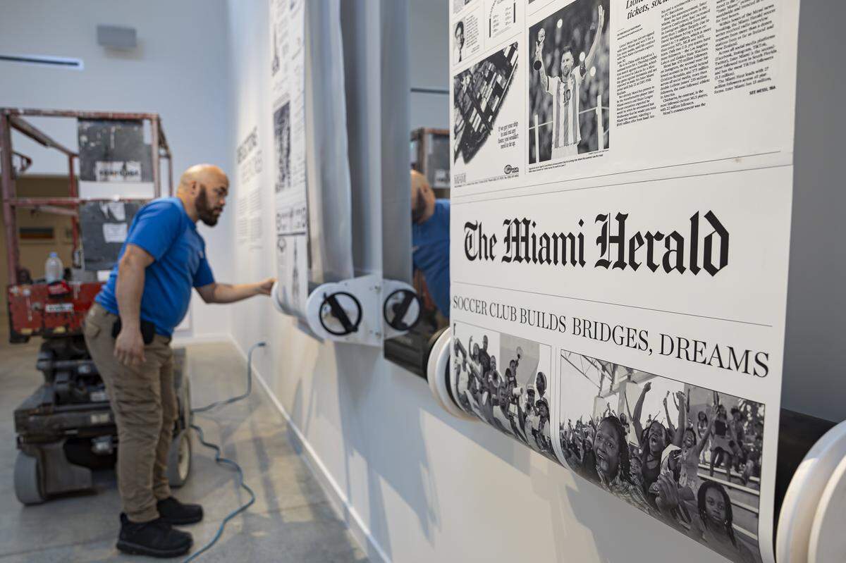 Mike Cruz, with Sho-Link, installs an art piece inside the Knight Skylight gallery at Miami Dade College's Freedom Tower on Friday, Sept. 12, 2025, in downtown Miami, Fla. The Freedom Tower is celebrating its 100th anniversary as it prepares to welcome the public back through its doors following a two-year restoration.