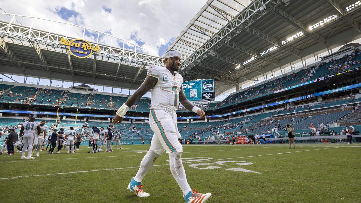 Miami Dolphins quarterback Tua Tagovailoa (1) walks off the field after losing against the New England Patriots in the second half of their NFL game at Hard Rock Stadium on Sunday, Sept. 14, 2025, in Miami Gardens, Fla.