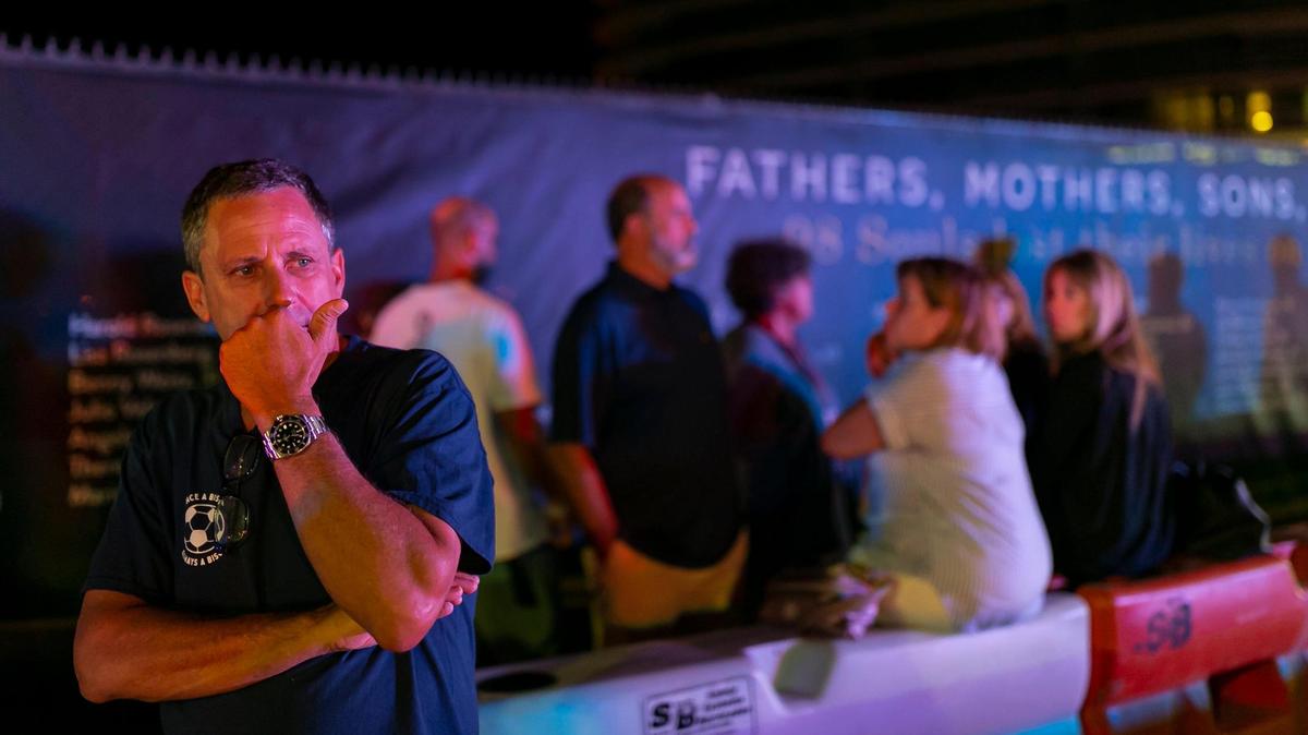 Pablo Langesfeld, the father of the late Nicole Langesfeld, reacts after arriving at the former Champlain Towers South condo building site on Thursday, June 23, 2022, in Surfside, Fla. Family members of the 98 victims of the June 24, 2021, condo collapse gathered at the site to mark the one year anniversary of the tragedy.