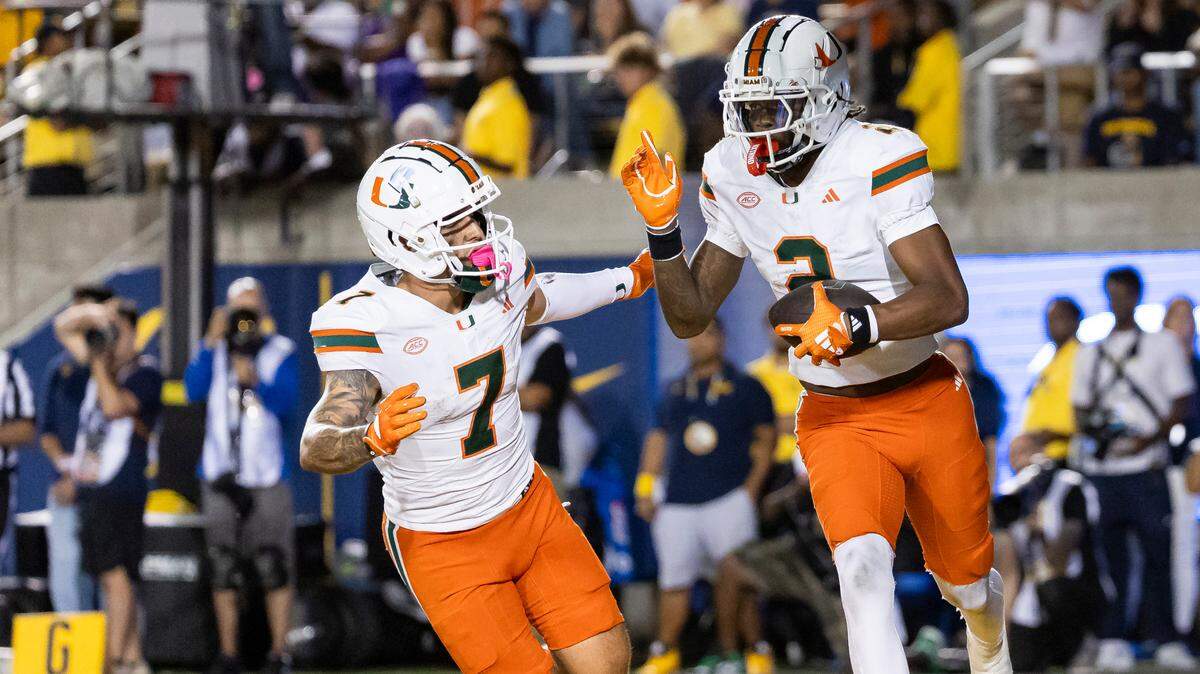 Miami Hurricanes wide receivers Isaiah Horton (2) and Xavier Restrepo (7) run back to the sideline after scoring a touchdown against the California Golden Bears in the second half of their NCAA college football game at the California Memorial Stadium on Saturday, Oct. 5, 2024, in Berkeley, Calif.