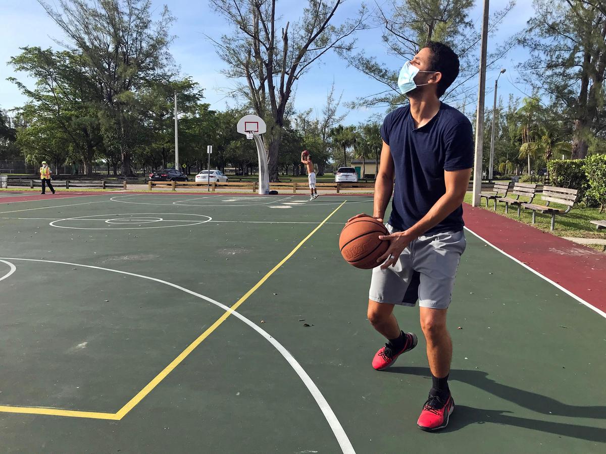 Enrique Castano, 30, shoots basketball at Tropical Park on Wednesday, April 29, 2020. Miami-Dade County reopened parks, including Tropical Park, with certain restrictions on Wednesday.