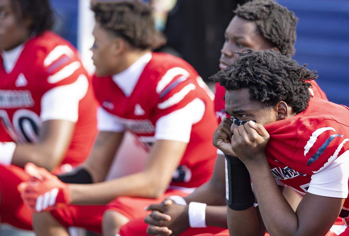 Chaminade-Madonna Lions quarterback Malik Leonard (14) looks on from the bench as his team plays against the Cardinal Newman Crusaders in the second half of their Class 1A state championship football game at Pitbull Stadium on Thursday, Dec. 11, 2025, in Miami, Fla.