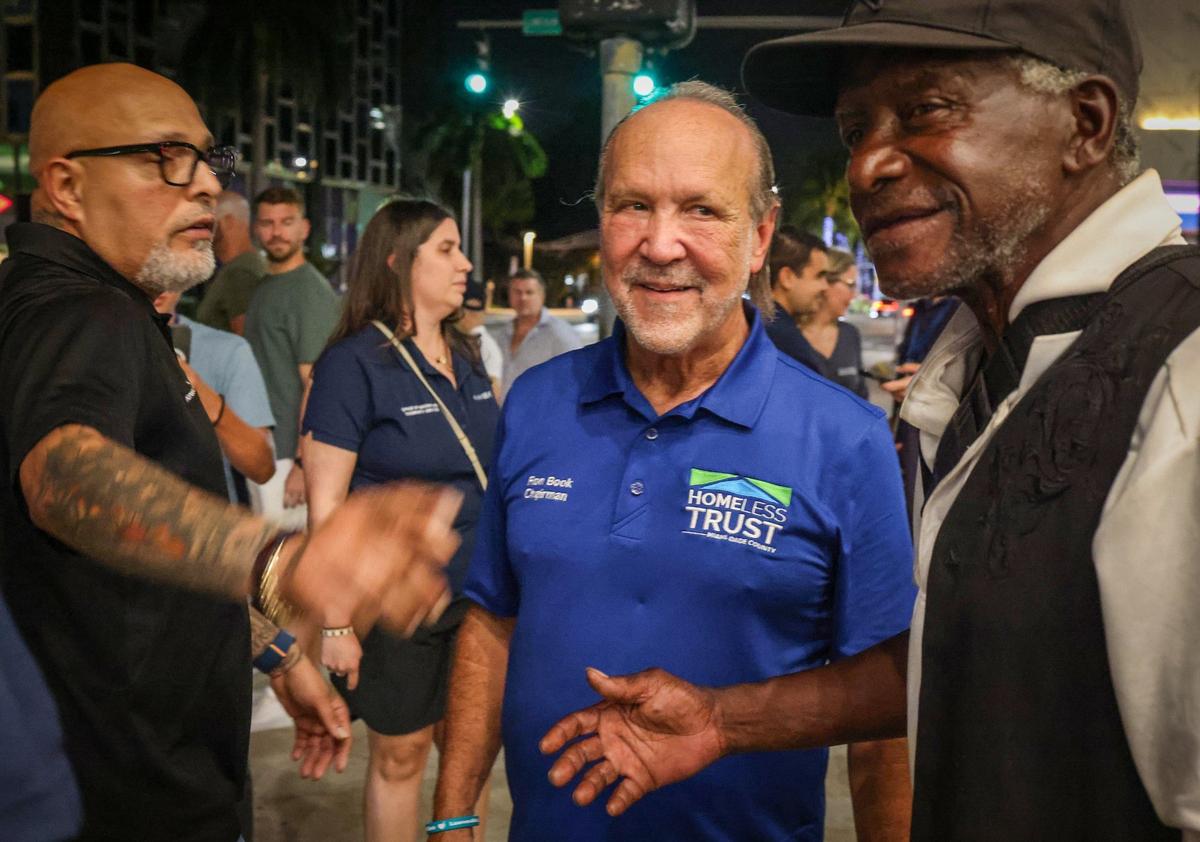 Miami-Dade County Homeless Trust Chairman Ron Book, center, participates in a count of the unsheltered population in Miami Beach on Thursday, Aug. 22, 2024.