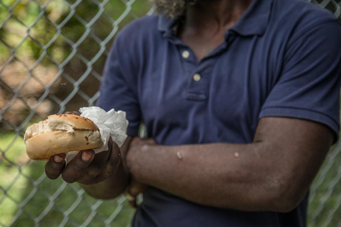 Philip Slyverin gets a bagel from University of Miami student athletes driving the Second Spoon food truck in Overtown in Miami on  Saturday, July 7, 2018