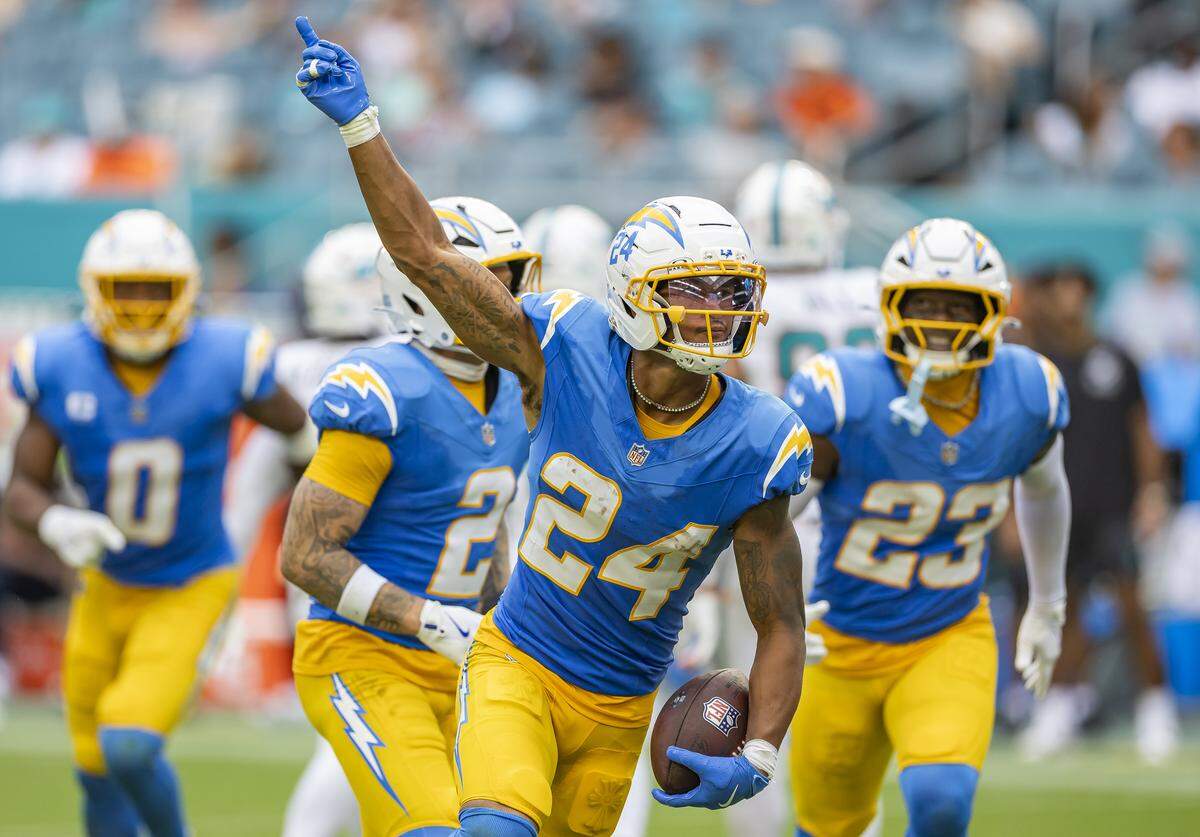 Los Angeles Chargers cornerback Benjamin St-Juste (24) celebrates after intercepting a pass by Miami Dolphins quarterback Tua Tagovailoa (1) in the second half of their NFL game at Hard Rock Stadium on Sunday, Oct. 12, 2025, in Miami Gardens, Fla.