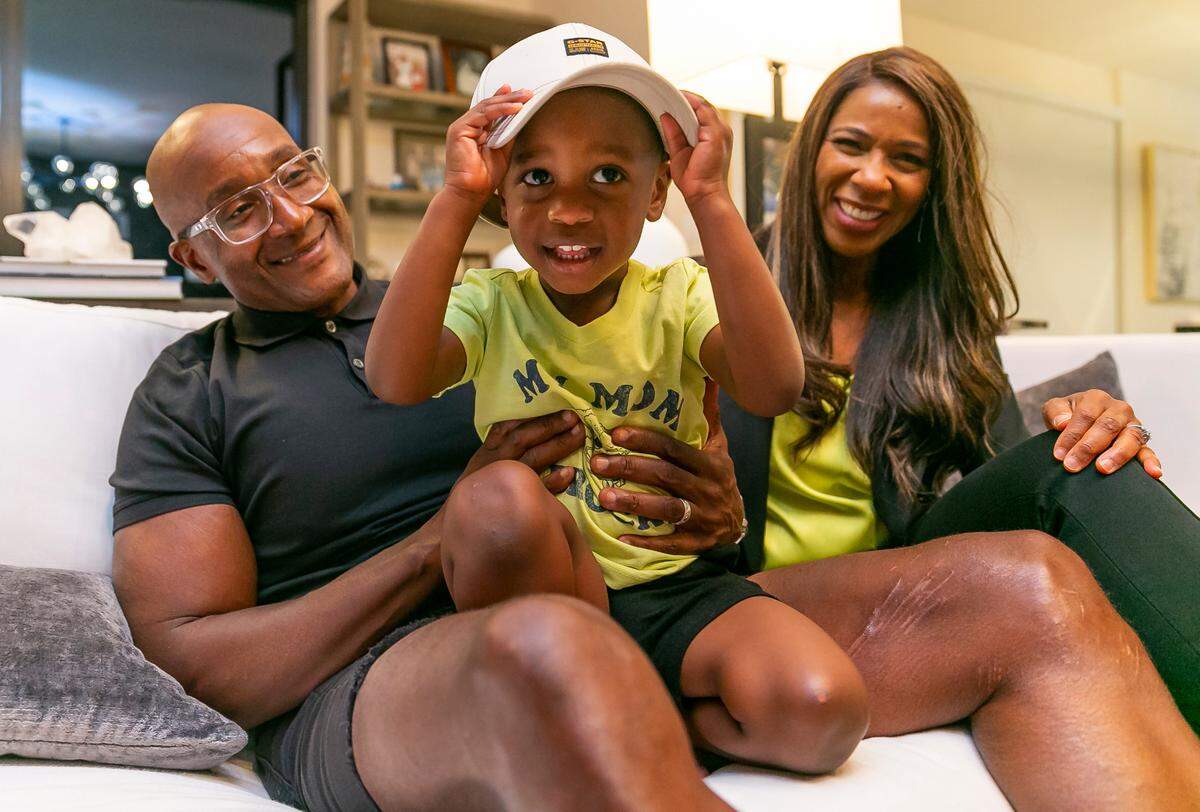 Symeria Hudson, president and CEO of Chapman Partnership, her husband, Gary Hudson, and their son, Garrett, have a playful moment inside their Fort Lauderdale home. Garrett turned 3 on Nov. 2.