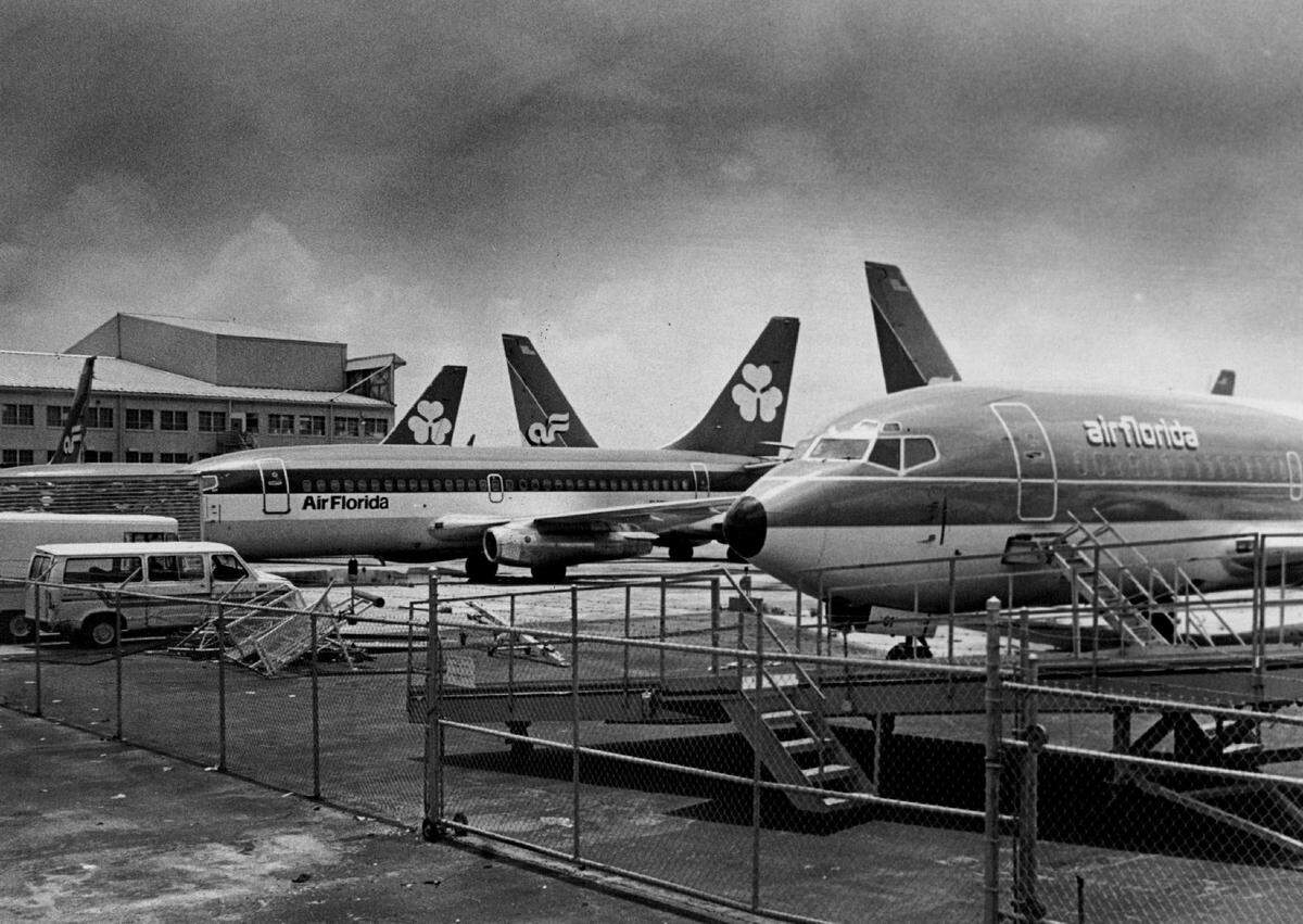 Air Florida airplanes parked at a Miami International Airport hangar along Northwest 36th Street in 1984.