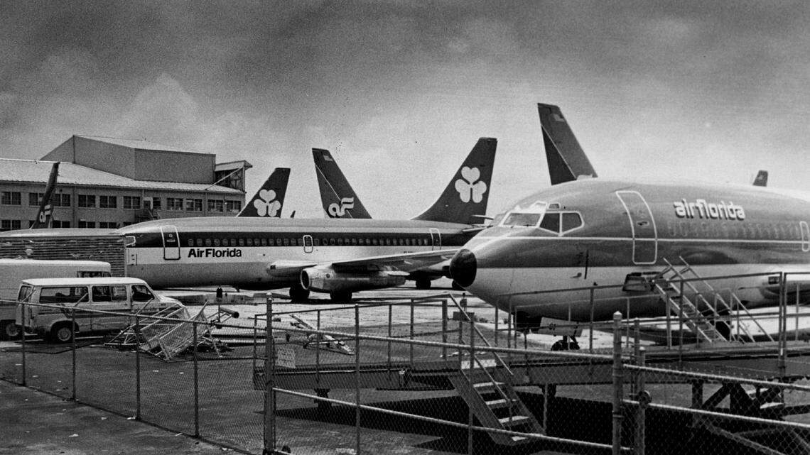 Air Florida airplanes parked at a Miami International Airport hangar along Northwest 36th Street in 1984.
