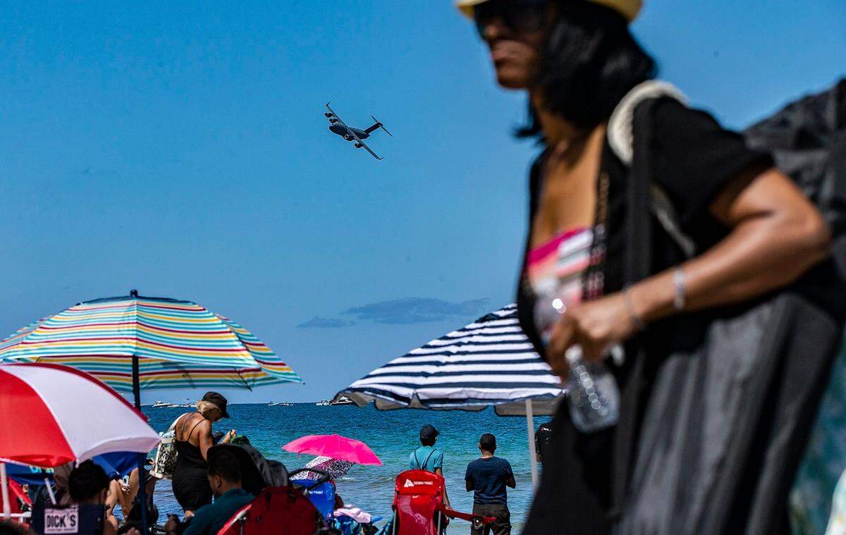 A C-130 Hercules U.S. Air Force transport airplane flies over South Beach during the Hyundai Air & Sea Show in Miami Beach in 2021.