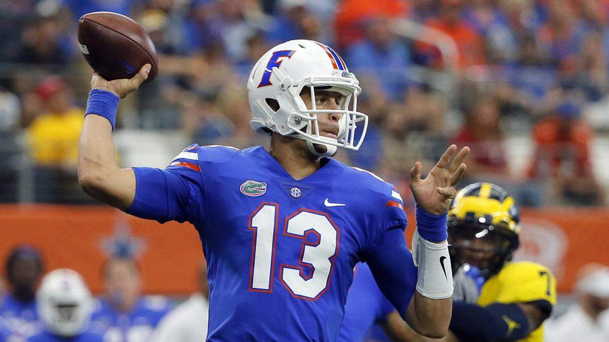 Florida quarterback Feleipe Franks (13) throws a pass during a game against Michigan in Arlington, Texas.