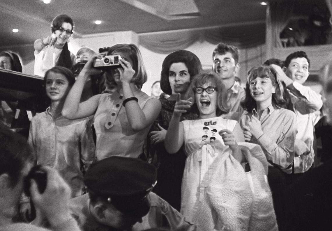 Beatles’ fans watch the group at a dress rehearsal for the Ed Sullivan Show at the Deauville Hotel in Miami Beach.
