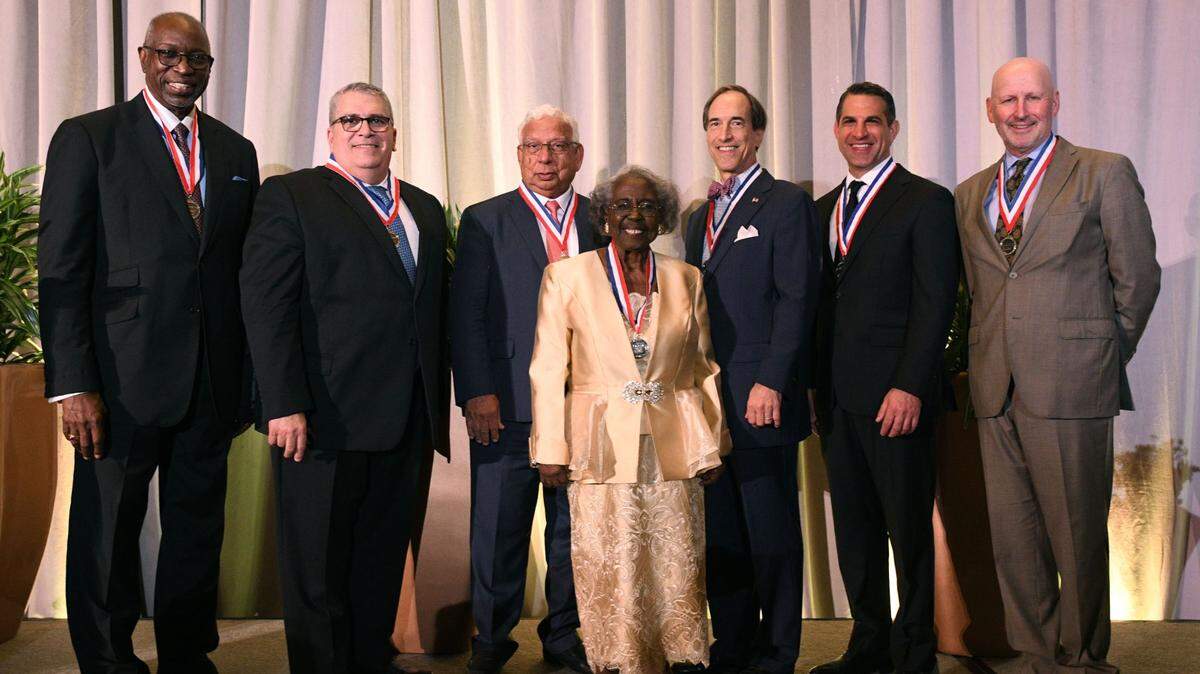 From left to right: Rev. Dr. Walter T. Richardson; Carlos J. Martinez; Khalid M. Mirza; Dr. Enid C. Pinkney; Benedict P. Kuehne; James R. Haj; and Jonathan Plutzik.