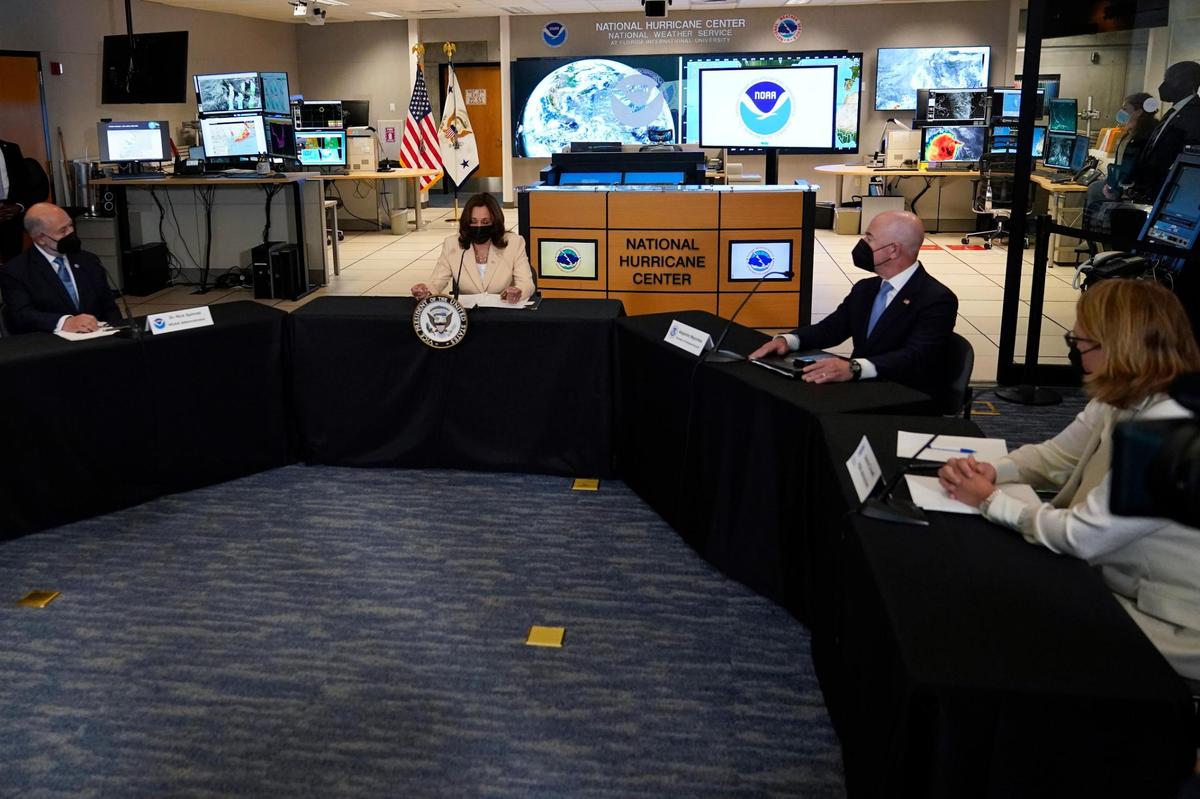 Vice President Kamala Harris, second from left, speaks at the National Hurricane Center on Monday, Aug. 1, 2022, in Miami. Harris is attending climate resilience events in Miami. Also seated at the table are. from left, NOAA Administrator Richard Spinrad, U.S. Department of Homeland Security Secretary Alejandro Mayorkas, and FEMA Administrator Deanne Criswell.