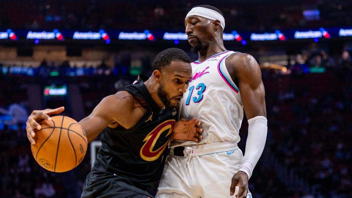 Cleveland Cavaliers forward Evan Mobley (4) attempts to drive into the paint past Miami Heat center Bam Adebayo (13) during the first half of an NBA game at Kaseya Center on January 29, 2025, in Miami.