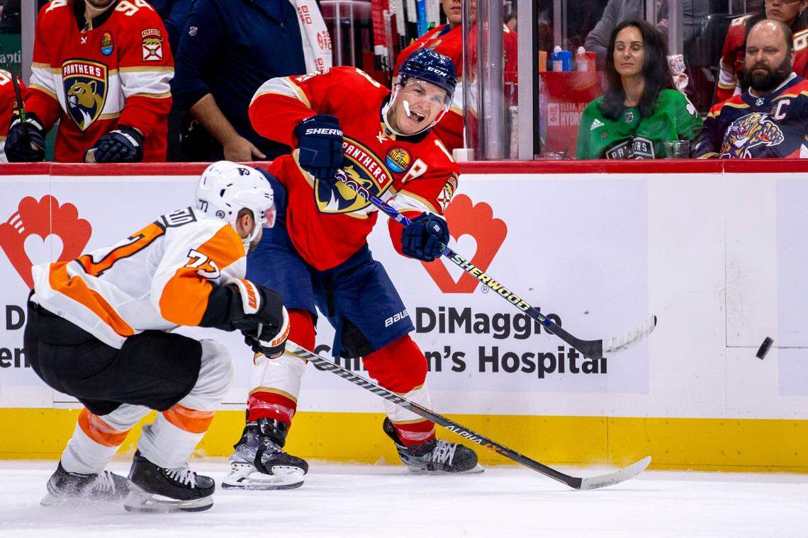 Florida Panthers left wing Matthew Tkachuk (19) shoots on goal while guarded by Philadelphia Flyers defender Tony DeAngelo (77) during the second period of an NHL game at FLA Live Arena in Sunrise, Florida, on Wednesday, October 19, 2022.