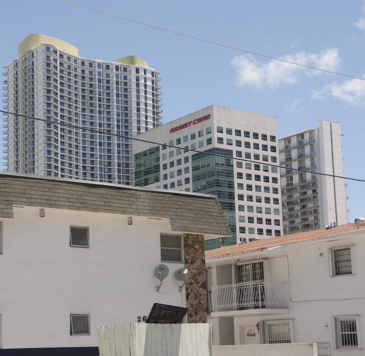 An aging apartment building in downtown Miami offers workforce housing in the shadow of international banks and residential towers.