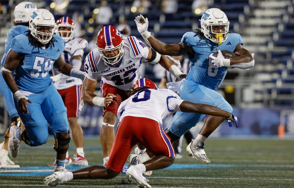 Florida International University Panthers running back Lexington Joseph (8) breaks a tackle during the game against the Louisiana Tech Bulldogs in the second half of an NCAA football game at Pitbull stadium on Saturday, September 28, 2024, in Miami, Fla.