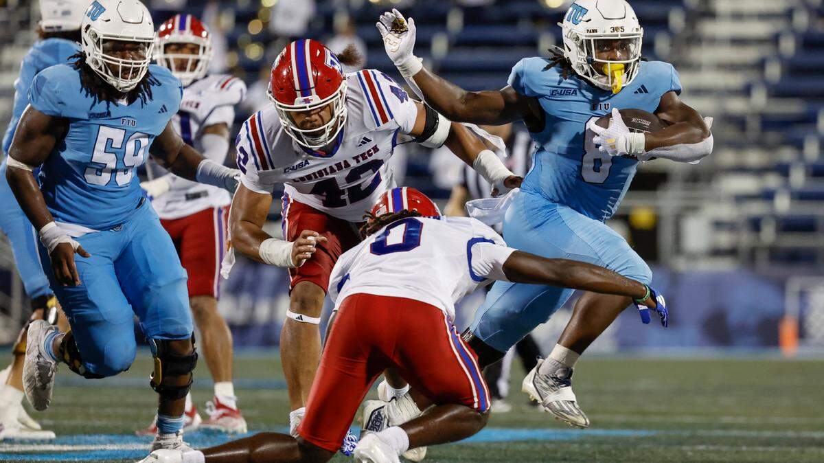 Florida International University Panthers running back Lexington Joseph (8) breaks a tackle during the game against the Louisiana Tech Bulldogs in the second half of an NCAA football game at Pitbull stadium on Saturday, September 28, 2024, in Miami, Fla.