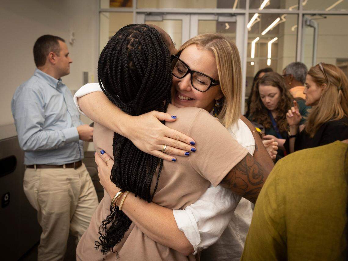 Lauren Jones, from the Elevate Prize Foundation, hugs her co-worker after the team gave away an award during the Give Miami Day fundraising event hosted by The Miami Foundation on Thursday, Nov. 16, 2023, held at Miami Dade College Medical Campus. “I want to feel proud of my city, I feel proud of my city today,” said Miami Foundation CEO Rebecca Fishman Lipsey.
