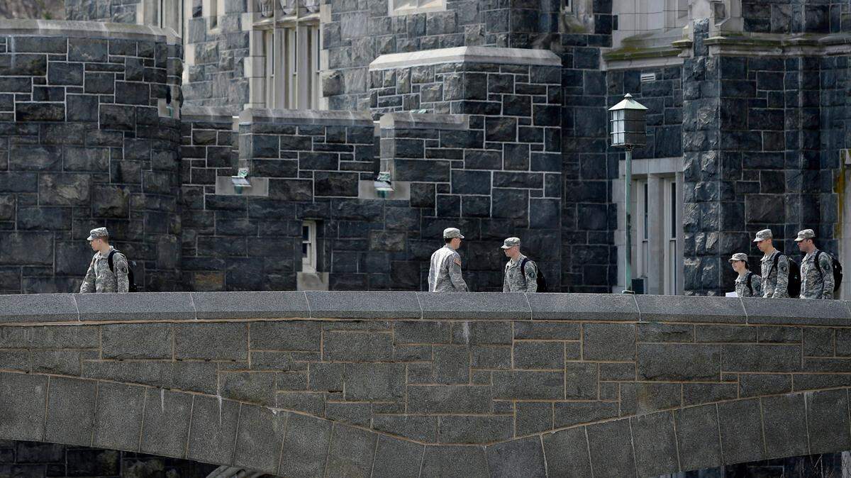 In this April 9, 2014 photo, West Point cadets walk on campus during lunchtime break at the United States Military Academy in West Point, N.Y.