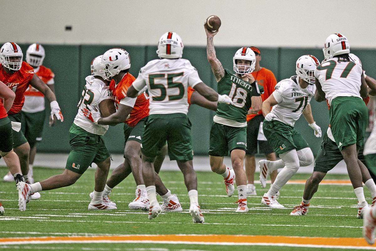 Miami Hurricanes quarterback Tate Martell throws a pass during the first session of University of Miami’s 2019 fall football practice at The Carol Soffer Indoor Practice Facility in Coral Gables on Friday, July 26, 2019. The Canes had to move indoors 48 minutes into practice because of lightning.