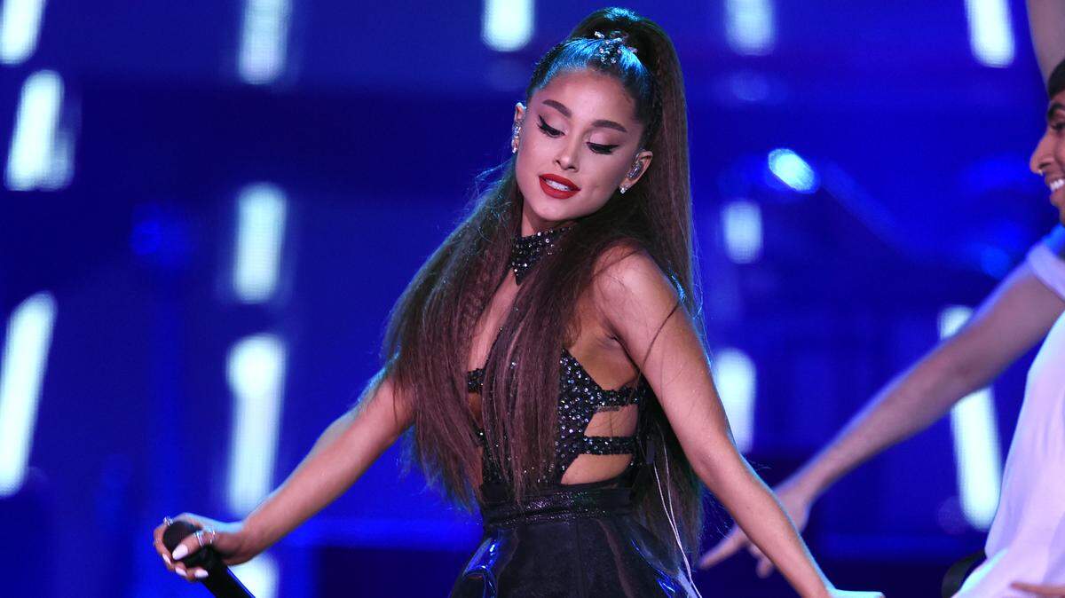 FILE - In this June 2, 2018 file photo., Ariana Grande performs at Wango Tango at Banc of California Stadium in Los Angeles. The singer cried during an interview Friday, Aug. 17, 2018 with Ebro for Beats 1 on Apple Music as she shared thoughts on the 2017 concert in England, when a suicide bomber killed 22 people. She said that terrorists “want you to be afraid,” adding that those who just heard about it in the news had moved on. But for her and others, the challenge became just to “live in the moment” and not be overwhelmed by fear. (Photo by Chris Pizzello/Invision/AP)