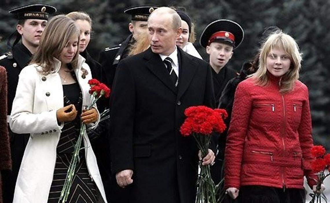 Vladimir Putin is pictured in November 2006 with Maria Bucher (left), who was then known by her maiden name Drokova.