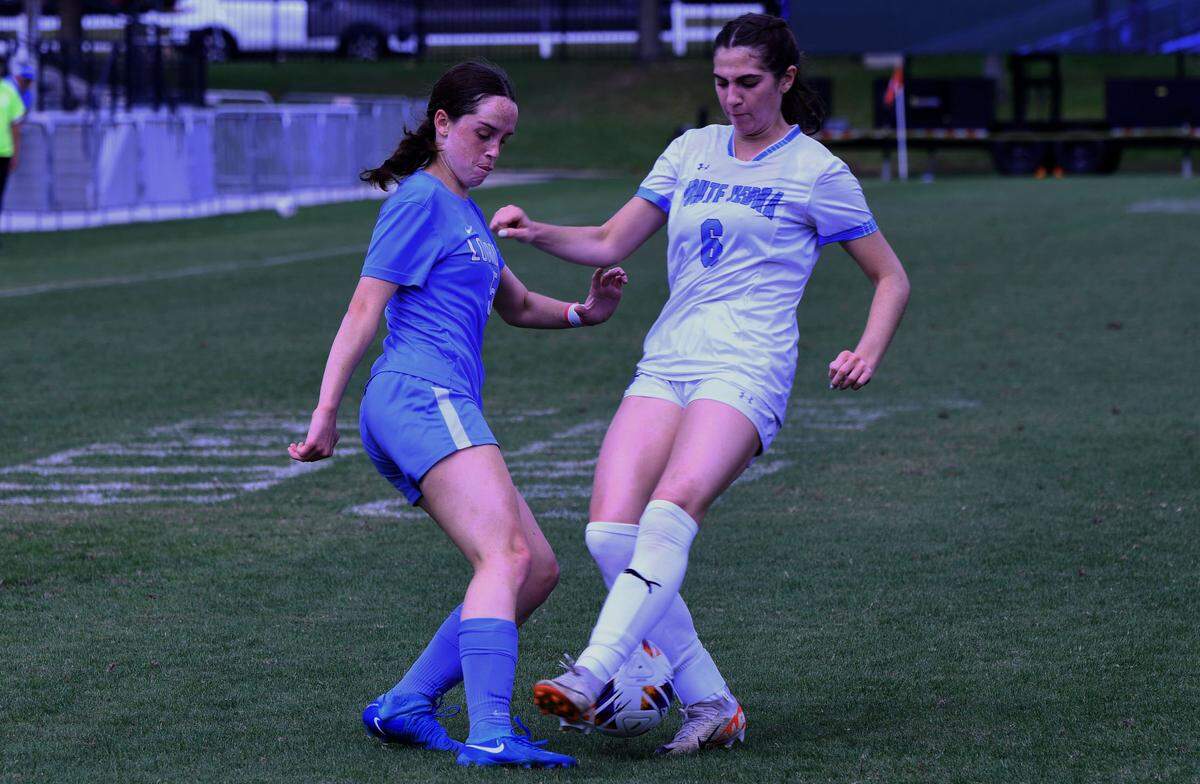 Lourdes Academy junior defender Jessica Lee battle fora 50-50 ball with Ponte Vedra senior Natalie McCann during the Class 5A girls soccer state championship game on Saturday at Lake Myrtle Sports Complex.
