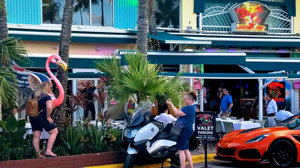Tourists love Ocean Drive. What’s not to love? There are giant pink flamingoes outside Mango’s Tropical Cafe.