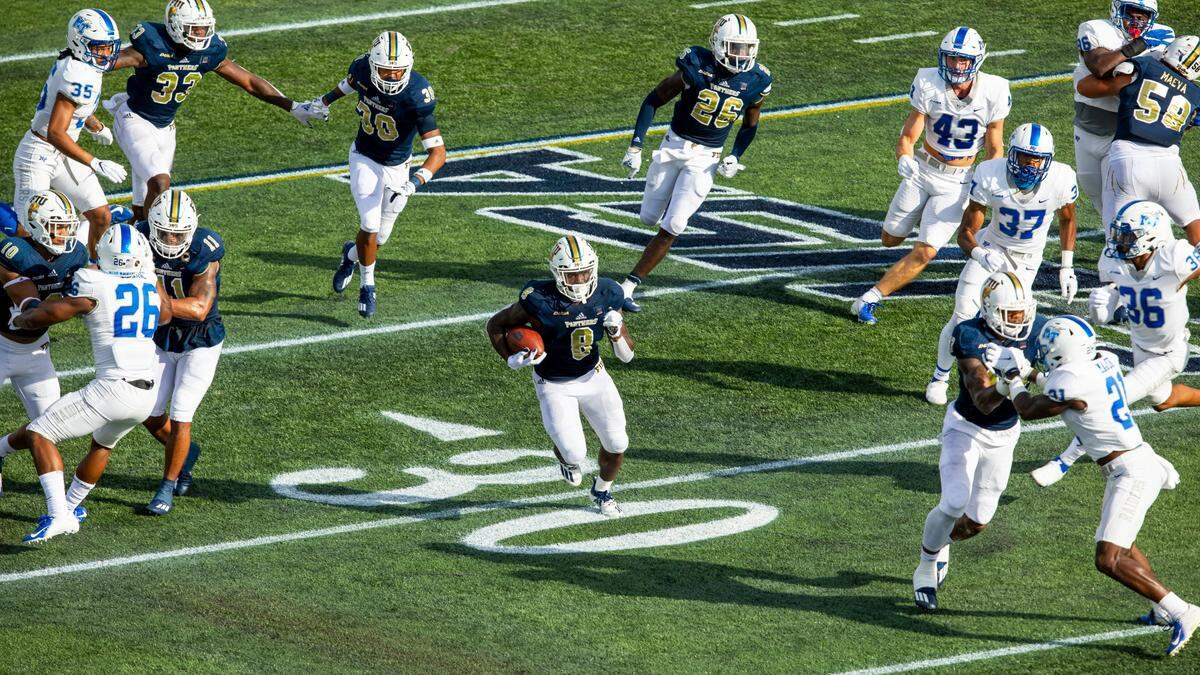 FIU running back Lexington Joseph (8) is swarmed by the Middle Tennessee special teams as he runs down field for the punt return Oct. 10, 2020.