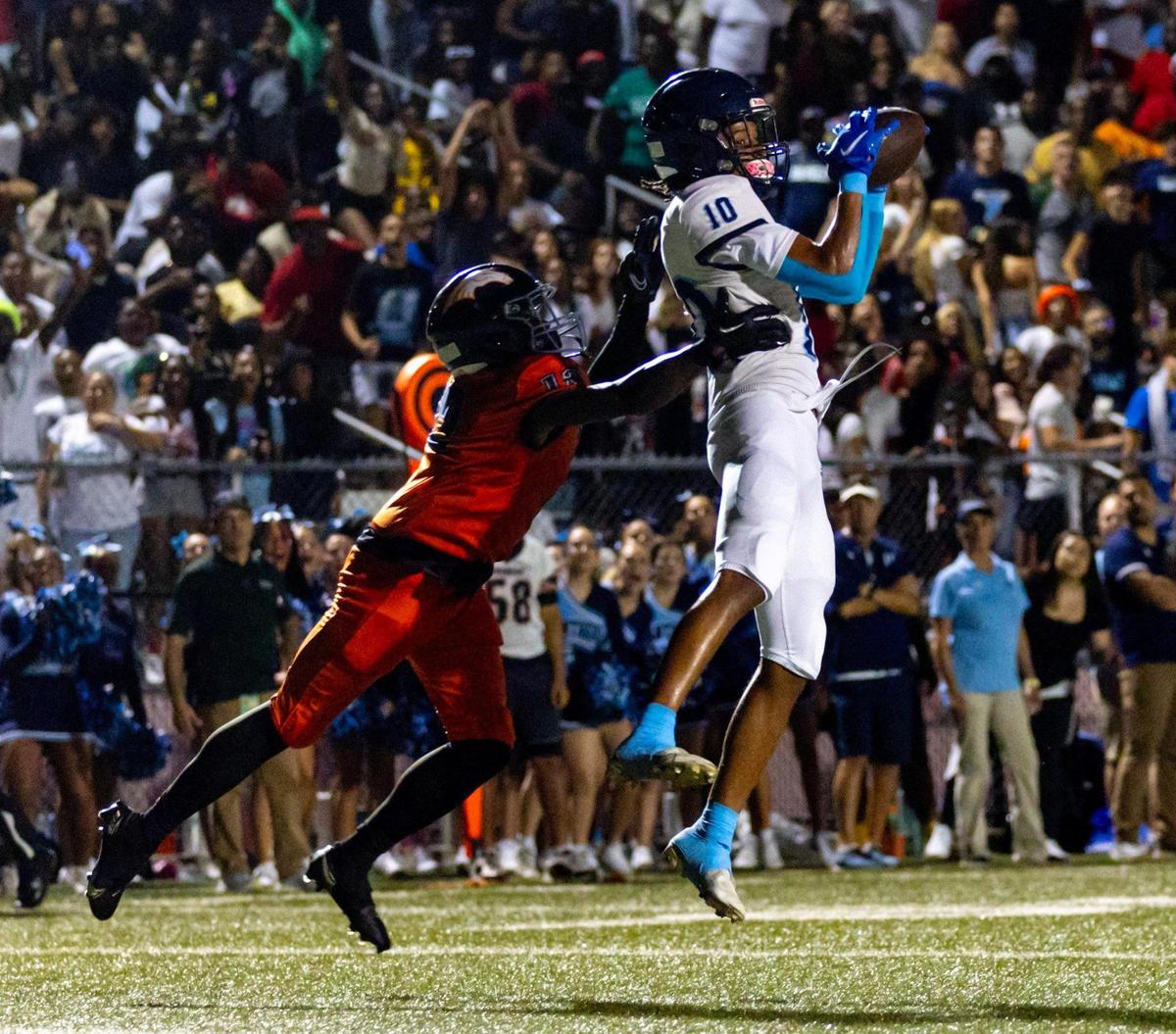 Palmetto wide receiver Fadrelle Andrus (10) makes a catch over Homestead defensive back Keyon Martin (12) during a high school football game at Harris Field in Homestead, Florida, on Friday, August 25, 2023.