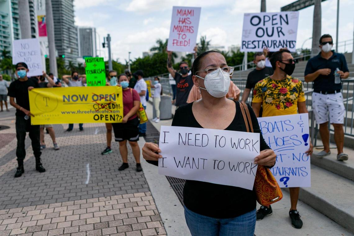 Helen Cantillo, 51, a waitress at Kao Sushi and Grill, attends a rally in front of AmericanAirlines Arena in downtown Miami on Friday, July 10, 2020, to protest Miami-Dade County Mayor Carlos Gimenez’s order to close inside dining at restaurants to avoid the spread of the coronavirus.