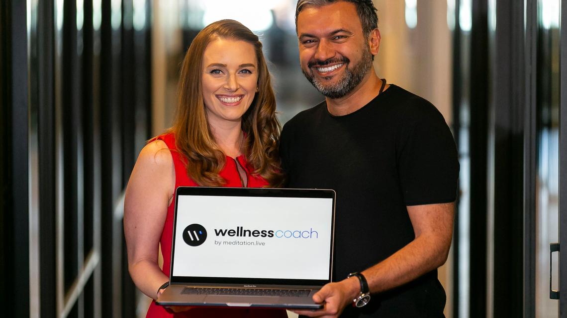 Julie and D Sharma, co-founders and chief executive officers of Wellness Coach, work from a WeWork in Miami Beach, Florida on Thursday, March 5, 2020. Wellness Coach, a live, interactive, and data-driven wellness platform, aims to provide companies and their employees with on-demand wellness services.