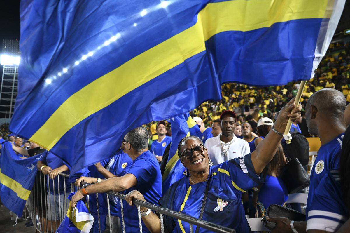 Curaçao fans celebrate the team’s World Cup 2026 qualification after a 0-0 draw with Jamaica in Kingston, Jamaica on Nov. 18, 2025.
