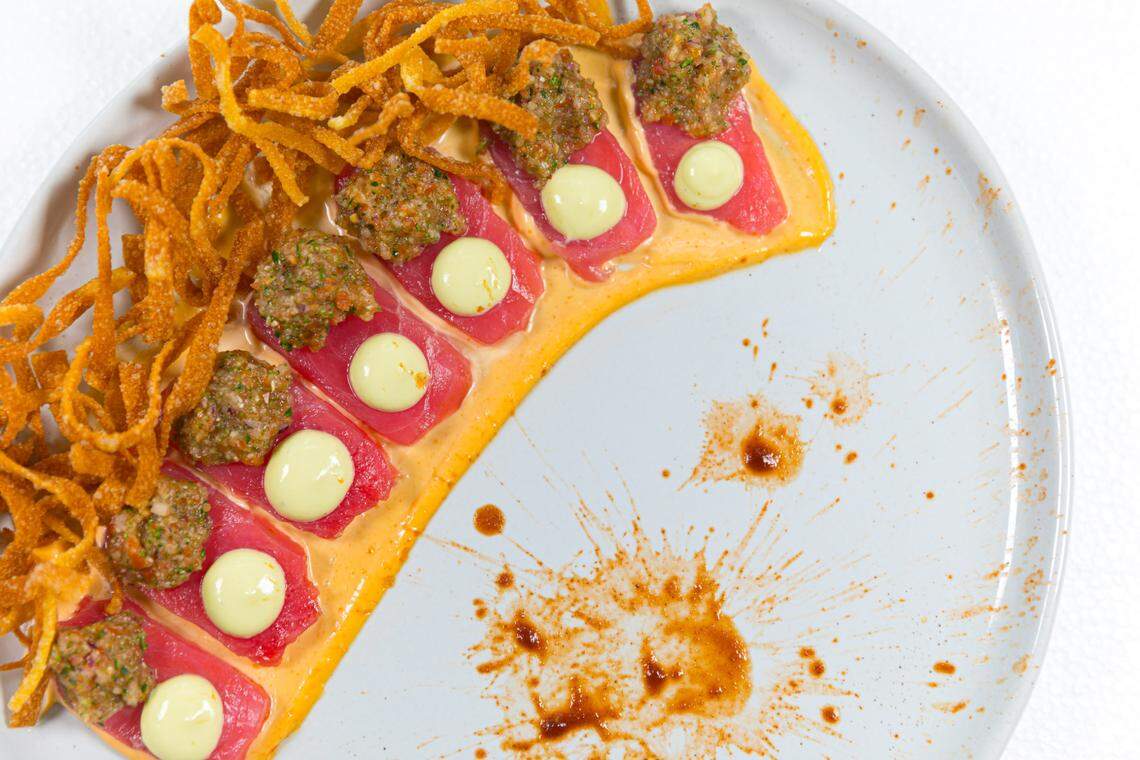 Ahi tuna sashimi with chipotle aioli and avocado cream is one of the dishes from the tuna and oyster raw bar at the new Red Fish restaurant.